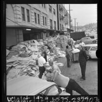Workers unloading ballots and other voting paraphernalia at Registrar of Voters warehouse in Los Angeles, Calif., 1966