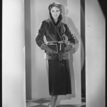 Peggy Hamilton modeling a fur jacket and matching hat, 1930