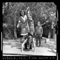 1956 Olympic gold medalist Olga Connolly-Fikotova playing with children at UCLA elementary school, 1970