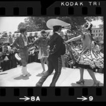 Dancers on Olvera Street performing for minibus crowd in Los Angeles, Calif., 1972