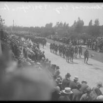 Soldiers marching in front of crowd during Memorial Day celebration at Exposition Park, Los Angeles, Calif., 1930