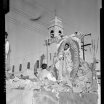 Our Lady of Guadalupe as portrayed on parade float by Maria Duran in Los Angeles, Calif., 1958