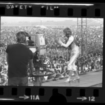 Ozzy Osbourne of Black Sabbath performing before crowd at California Jam concert in Ontario, Calif., 1974