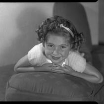 Sylvia Arslan lying on cushion, [1938-1939?]