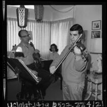 15 year old violinist Glenn Dicterow rehearsing with his parents Harold and Irina in Los Angeles, Calif., 1964