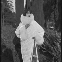 Actress (?) modeling an ermine (?) coat, circa 1930-1931