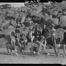 Young women on beach playing leapfrog, Pacific Palisades, 1928