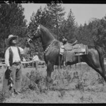 Rodeo performer and horse, Lake Arrowhead Rodeo, Lake Arrowhead, 1929