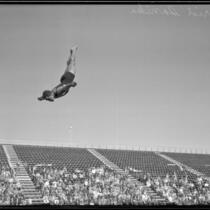 Farid Simaika, Olympic diver, in straight position during the flight of a dive, between 1928-1939