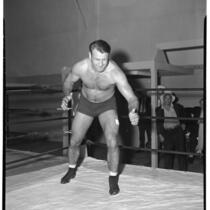 Heavyweight wrestling champion Bronko Nagurski prepares to take on challenger Vincent Lopez, Los Angeles, 1937