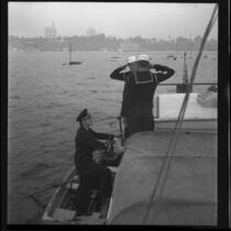 Sea Scouts aboard Pinta, saluting arriving officer, Balboa, 1937
