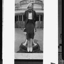 Young woman seated on bollard, Erie, Pennsylvania, [1936?]