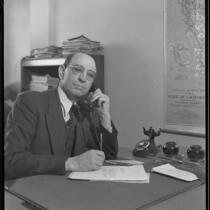 Arturo Rios, Chilean Consul-General in Los Angeles, seated at his desk, Los Angeles, 1934