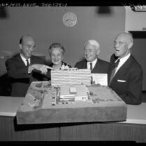 Clark Kerr, Lillian Dykstra, Donald H. McLaughlin, and Vern O. Knudsen viewing model of UCLA's Dykstra Dormitory, 1959