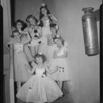 Helena Burnett and other child ballerinas pose on staircase, 1947-1950