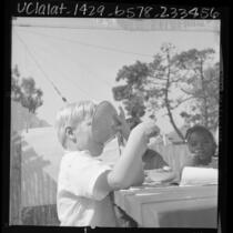 Children eating at Head Start program in Los Angeles, Calif., 1966
