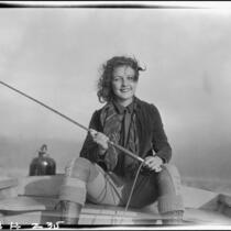 Sally Phipps in boat fishing, Lake Arrowhead, 1929