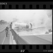 Tanker truck sprawled across 405 freeway spilling molten sulfur in Culver City, Calif., 1986