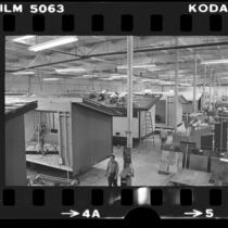 Workers building prefabricated houses in factory in Fountain Valley, Calif., 1976