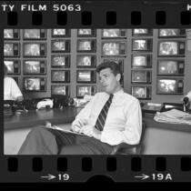 ABC producer Jeff Ruhe in his Hollywood, Calif. control center that contains 77 TV sets, 1984