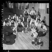 Torao Mori teaching Centinela Valley Japanese youngsters rudiments of kendo in Lawndale, Calif., 1958