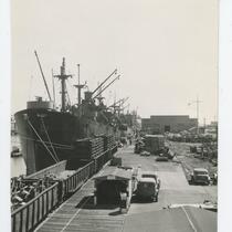 Ship docked in San Pedro Harbor next to commercial products, February 23, 1945