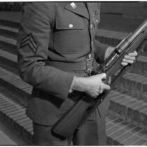 Soldier holding the U.S. Army's new Garand rifle, on display as part of National Defense week, Los Angeles, February 1940