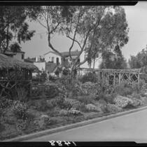 Pergola with thatched-roof and rustic wood garden structures, Santa Monica, 1928