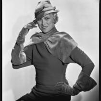 Peggy Hamilton modeling a dress with sporty plaid-fabric accessories, circa 1931-1933