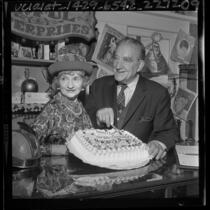 Actor Francis X. Bushman and wife Ivy, cutting cake on his 82nd birthday in Los Angeles, Calif., 1965