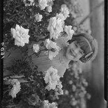 June Starr Carroll among roses, 1925