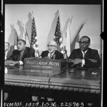 Christopher Taylor, Augustus F. Hawkins and Dr. H. Hartford Brookins holding a press conference in Los Angeles, Calif., 1964