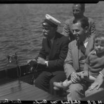 Bert Levy, Clifford McBride and son, and 1 man on boat, Lake Arrowhead, 1929
