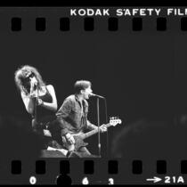 X's Exene Cervenka and John Doe performing at the Greek Theater, Calif., 1983