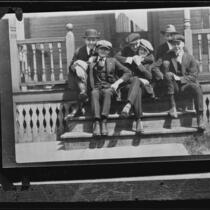 Actor Clark Gable as a young man with group of young men on porch, [Ohio?], [1920s?]