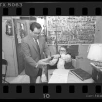 55th Assembly District candidate Richard Polanco filing his absentee ballot in person, Los Angeles, Calif., 1986
