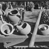 Grinding stones and Indian pottery at home of Eugene R. Plummer, Hollywood, 1927