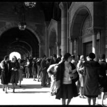 Registration - Students walking through Royce Hall colonnade, 1930