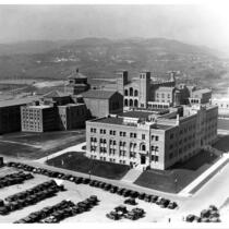 Aerial view of Physics-Biology Building (Humanities Building) with Library (Powell Library) and Royce Hall in background, 1930