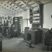 Interior of the shoe shop at Mission Santa Barbara, Santa Barbara, circa 1898-1900