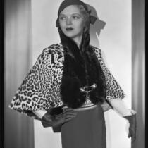 Actress (?) modeling a fur stole, circa 1931-1933