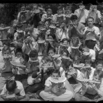 Thomas Starr King Junior High boys eating watermelons, Los Angeles, 1934