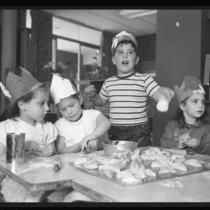 Youngsters make Hamentaschen cookies for Purim Festival, Calif., 1958