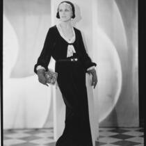 Peggy Hamilton modeling a long dress of chiffon velvet and Alençon lace, 1930