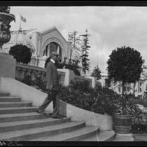 Man descending stairs near the Manufactures Building at the Alaska-Yukon-Pacific Exposition, Seattle, 1909