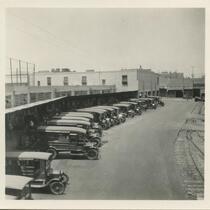 Postal trucks parked next to train tracks behind Arcade Post Office, Los Angeles, June 25, 1926