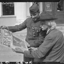 Veterans Robert W. Renton and George L. Grimston with 1918 newspaper, Los Angeles, 1928 or 1930