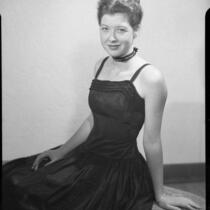 Patricia Pratt seated on bench, Santa Monica, 1947