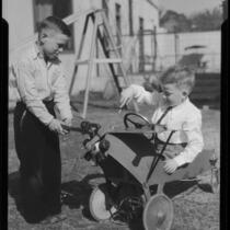 Boys repairing toy airplane wagon, Los Angeles, circa 1935