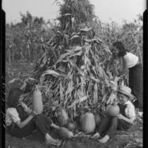 Carolyn Bartlett, Sonny Cates, and Maxine Cates with corn and pumpkins, Santa Monica, 1931